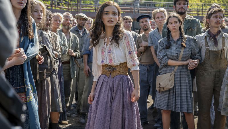 This image released by Lionsgate shows Rachel Zegler, center, in a scene from “The Hunger Games: The Ballad of Songbirds and Snakes.”