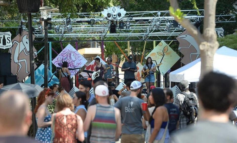 Crowds gather around the main stage waiting for the bands to play on the Fulton Mall during the Catacomb Party on July 20, 2013.