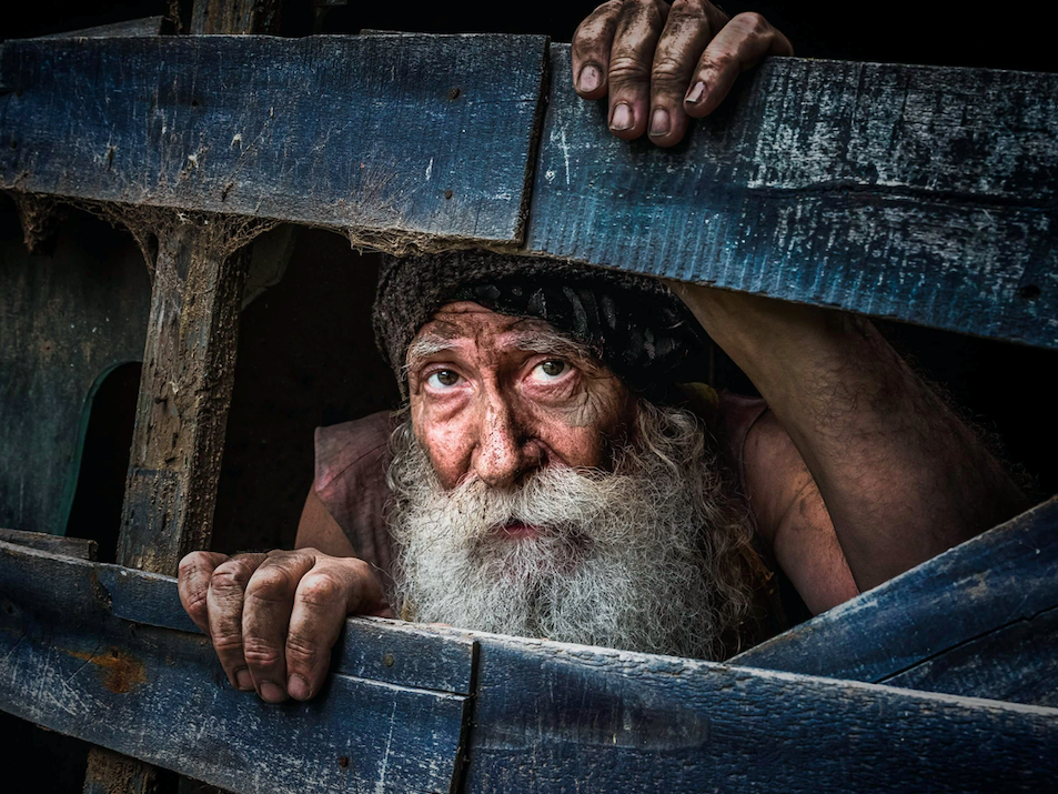 A farmer looking through a fence in Quilmes, Argentina.