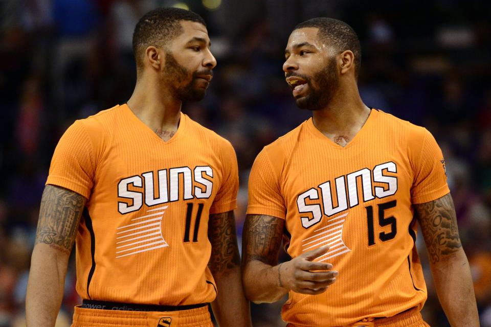Marcus Morris (15), at right, shown here on March 27, 2015, had his twin brother Markieff Morris (11)  as a teammate for a time on the Phoenix Suns.
