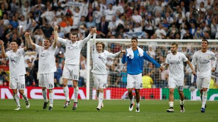 Football Soccer - Real Madrid v Manchester City - UEFA Champions League Semi Final Second Leg - Estadio Santiago Bernabeu, Madrid, Spain - 4/5/16 Real Madrid's James Rodriguez, Mateo Kovacic, Gareth Bale, Luka Modric, Raphael Varane, Jese and Cristiano Ronaldo celebrate with fans after the game Reuters / Paul Hanna