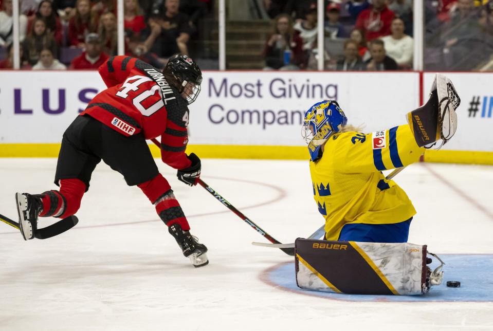 Canada forward Blayre Turnbull (40) scores against Sweden goaltender Emma Soderberg (30) during the first period of a quarterfinal match at the women's world hockey championships in Brampton, Ontario, Thursday, April 13, 2023. (Frank Gunn/The Canadian Press via AP)