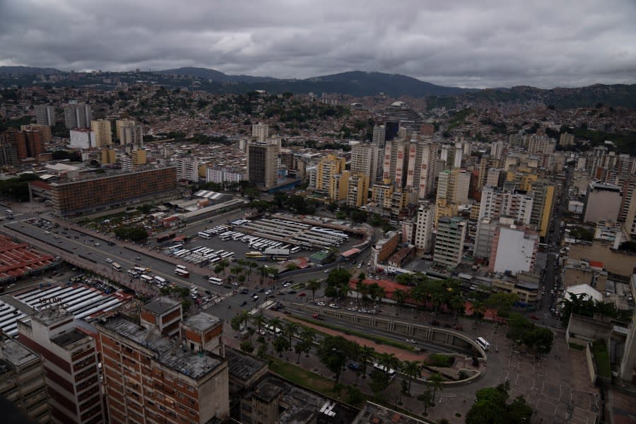 FILE – Cars circulate along Bolivar Avenue past La Bandera bus terminal in downtown Caracas, Venezuela, Sept. 12, 2022. A secret memo obtained by The Associated Press details a covert operation by the U.S. Drug Enforcement Administration that sent undercover operatives into Venezuela to record and build drug-trafficking cases against the country’s leadership – a plan the U.S. acknowledged from the start was arguably a violation of international law. (AP Photo/Ariana Cubillos, File)