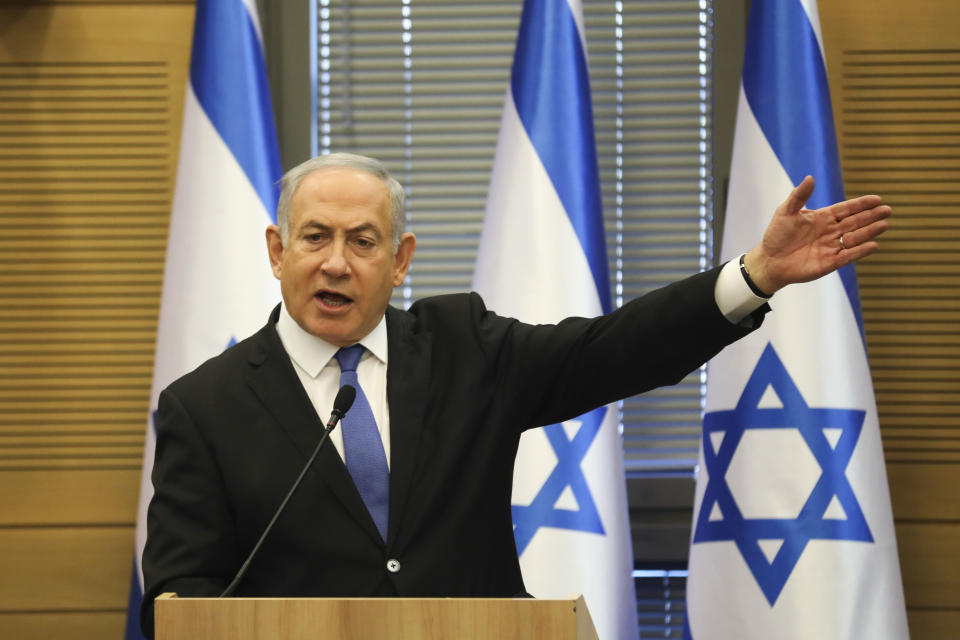 FILE - In this Wednesday, Nov. 20, 2019 file photo, Israeli Prime Minister Benjamin Netanyahu speaks during an extended faction meeting of the right-wing bloc members at the Knesset, in Jerusalem. Israel’s attorney general has formally charged Netanyahu in a series of corruption scandals. Attorney General Avichai Mandelblit issued an indictment Thursday, Nov. 21, 2019, charging Netanyahu with fraud, breach of trust and bribery. Netanyahu has denied any wrongdoing and said he is a victim of a witch hunt. (AP Photo/Oded Balilty, File)