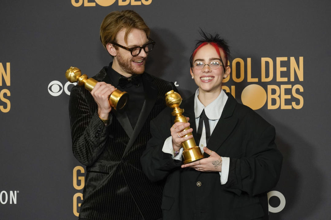 Finneas and Billie Eilish pose backstage with their trophies Golden Globe Awards in Beverly Hills, Calif., Sunday. (Chris Pizzello/AP)