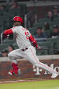 Philadelphia Phillies' Odubel Herrera heads to first with an RBI single against the Atlanta Braves during the fourth inning of a baseball game Wednesday, May 25, 2022, in Atlanta. (AP Photo/John Bazemore)