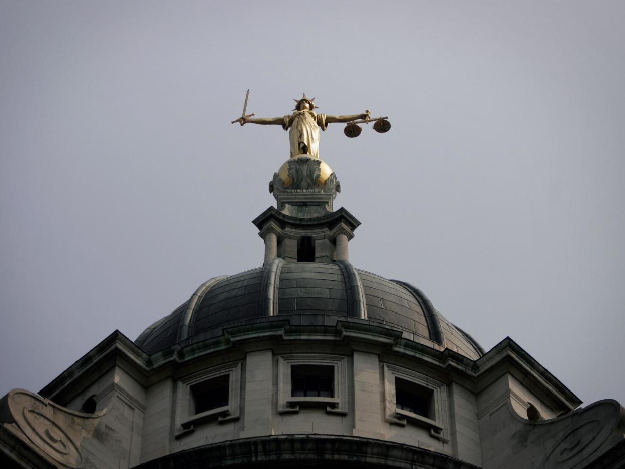 General view of the scales of justice on top of the Old Bailey, in London: Getty