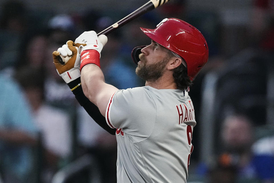 Philadelphia Phillies' Bryce Harper watches his solo home run against the Atlanta Braves during the fifth inning of a baseball game Thursday, May 25, 2023, in Atlanta. (AP Photo/John Bazemore)