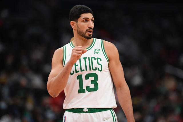 Enes Kanter Freedom holds up his fist during a game.