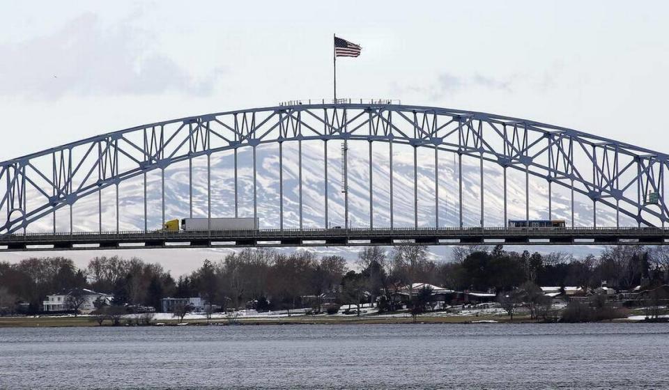 A snowy Rattlesnake Mountain is framed by the Highway 395 blue bridge in 2016.