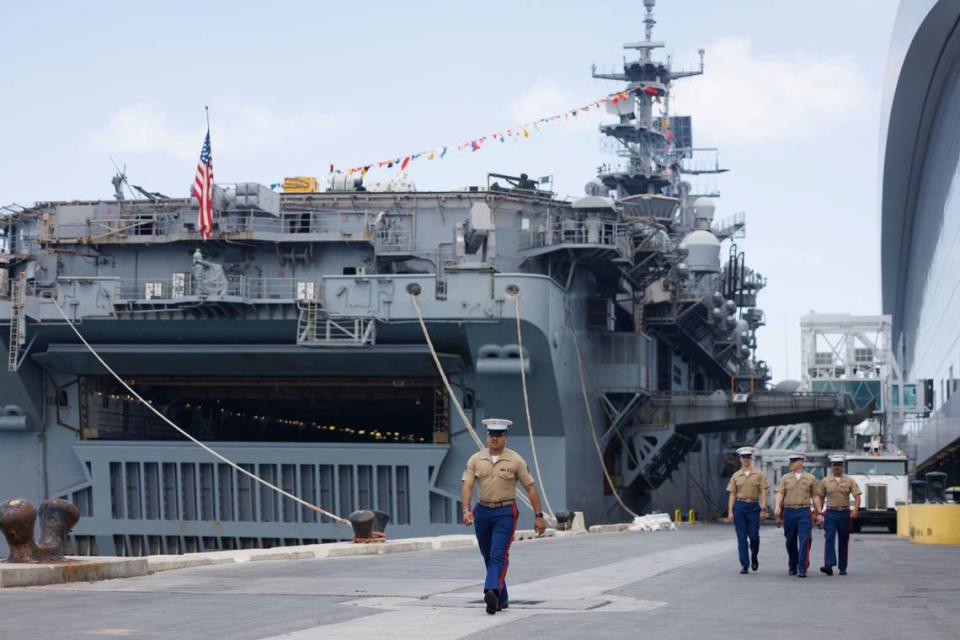 Membres of the United States Marine Corps walk in front of the USS Bataan during the opening day of Fleet Week on Monday, May 6, 2024, at Norwegian Cruise Lines Terminal in PortMiami. Alie Skowronski/askowronski@miamiherald.com
