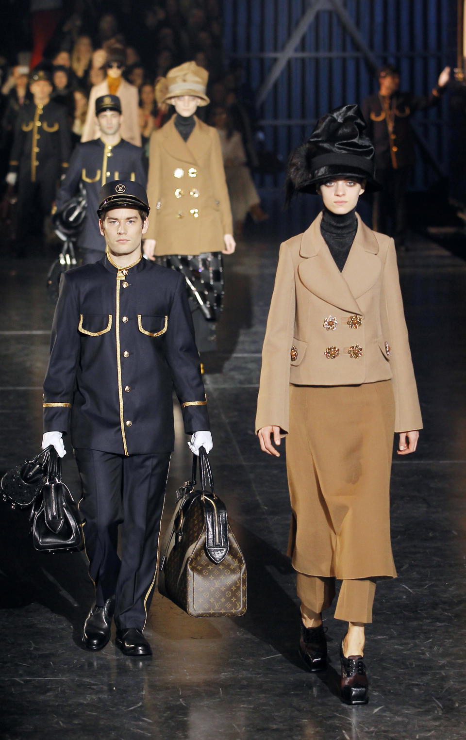 Models wear creations by U.S fashion designer Marc Jacobs for his Louis Vuitton collection, Women's Fall-Winter, ready-to-wear 2013 during Paris Fashion week, Wednesday, March 7, 2012. (AP Photo/Jacques Brinon)