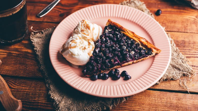 Juneberry pie with vanilla ice cream