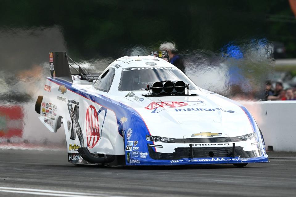 a race car with smoke coming out of it