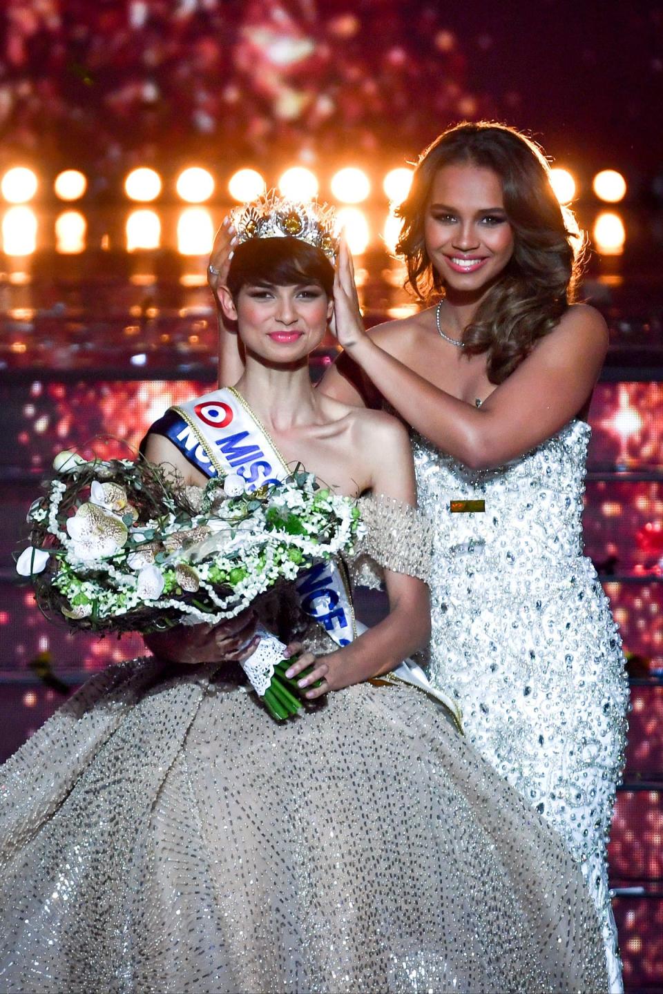 Eve Gilles is crowned Miss France 2024 by previous winner, Indira Ampiot (AFP via Getty Images)