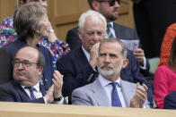 Spain's King Felipe, right, sits in the Royal Box on Centre Court for the final of the men's singles between Spain's Carlos Alcaraz and Serbia's Novak Djokovic on day fourteen of the Wimbledon tennis championships in London, Sunday, July 16, 2023. (AP Photo/Kirsty Wigglesworth)
