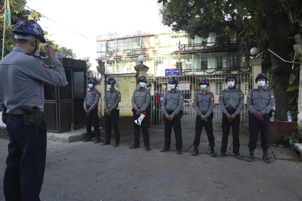 Police officers provide security as Buddhist monk Wirathu, arrives at a police station in Yangon, Myanmar, Monday Nov. 2, 2020. Wirathu, a nationalist Buddhist monk in Myanmar noted for his inflammatory rhetoric, has surrendered to police, who have been seeking his arrest for over a year for insulting comments he made about the country’s leader, State Counsellor Aung San Suu Kyi. (AP Photo/Thein Zaw)