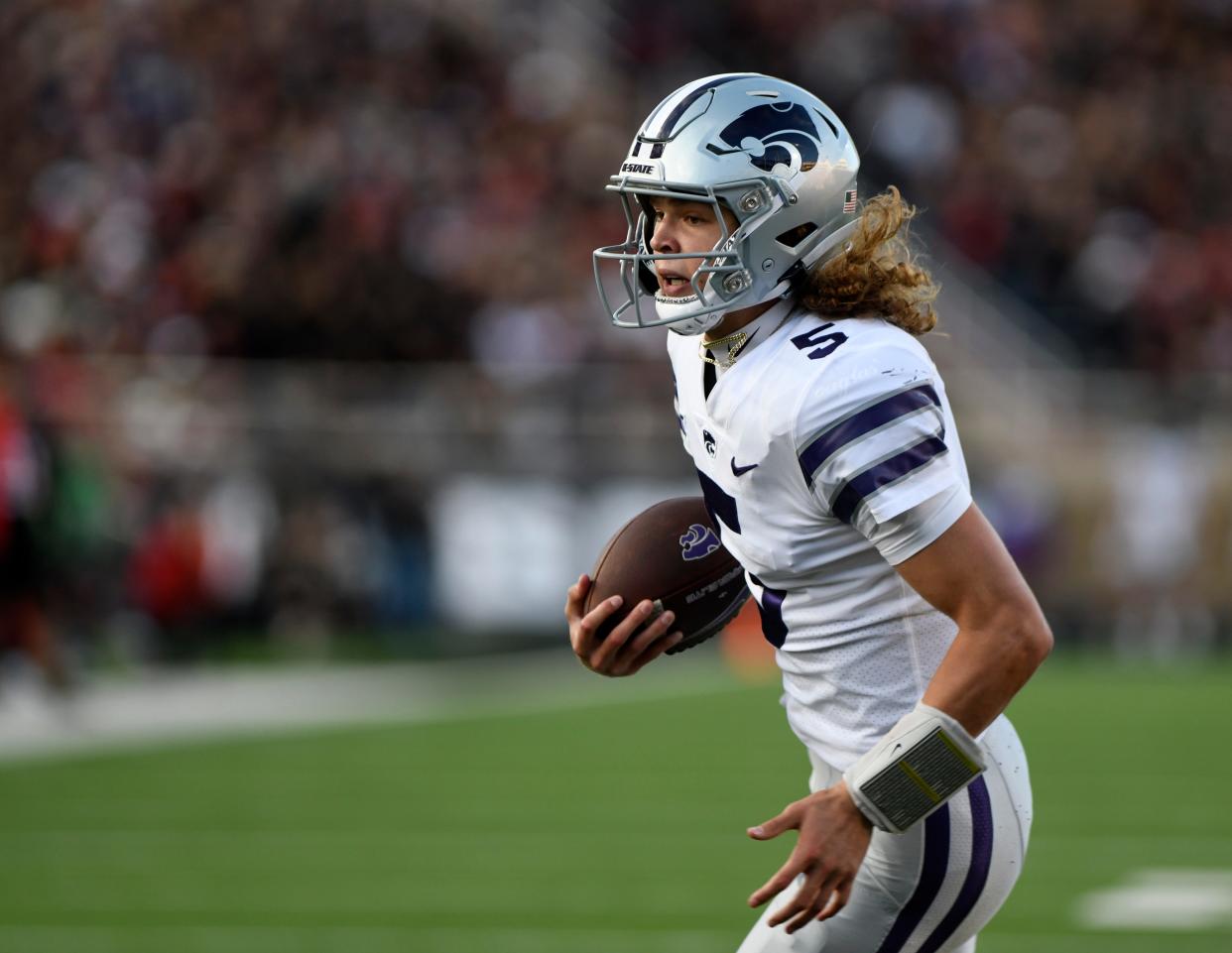 Kansas State quarterback Avery Johnson (5) runs for a touchdown against Texas Tech on Saturday night at Jones AT&T Stadium in Lubbock, Texas.