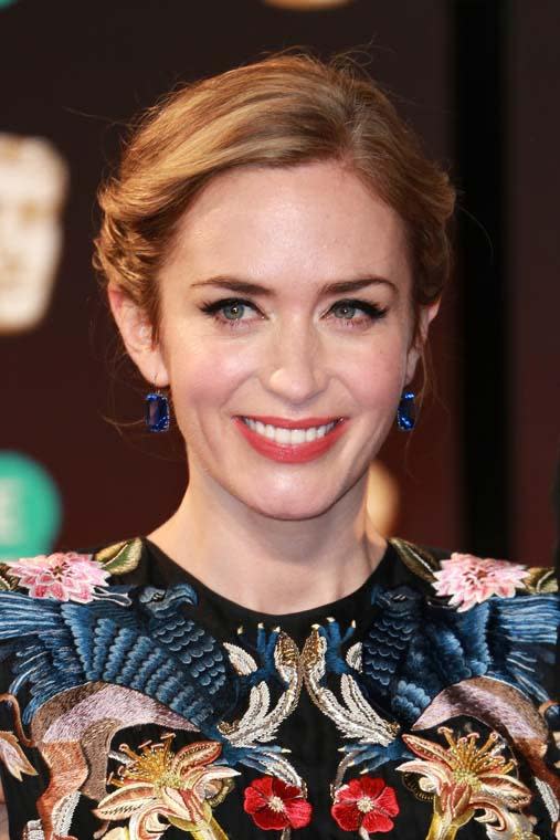 The ever-glowing Emily Blunt dazzled with a mega-watt smile on the carpet, matching her multicolored dress with a sexy red lip and copious amounts of black eyeliner.