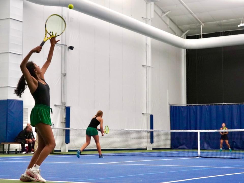 Mason's Pratyusha Chauduri serves the ball as she and her doubles partner, Emma Wagner, compete for the OHSAA Division I state championship in doubles tennis. Friday, Oct. 20, 2023 at the Aspen Racquet Club in Wooster, Ohio