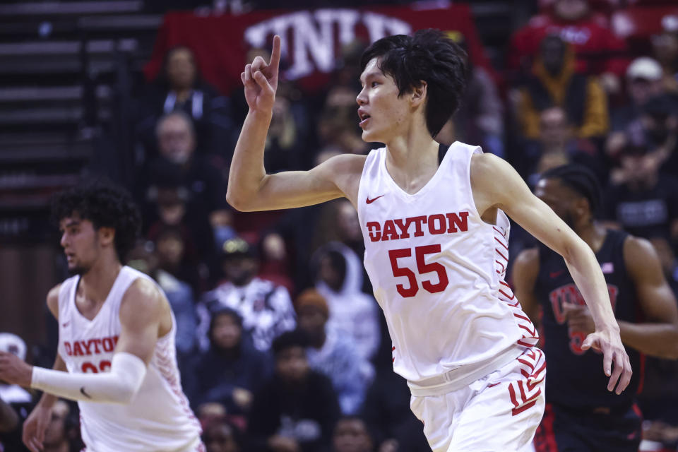 Dayton forward Mike Sharavjamts (55) reacts after scoring a 3-point basket against UNLV during the first half of an NCAA college basketball game Tuesday, Nov. 15, 2022, in Las Vegas. (AP Photo/Chase Stevens)