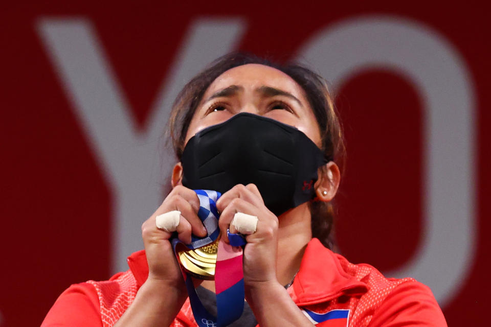 Tokyo 2020 Olympics - Weightlifting - Women's 55kg - Medal Ceremony - Tokyo International Forum, Tokyo, Japan - July 26, 2021. Gold medalist Hidilyn Diaz of the Philippines reacts. REUTERS/Edgard Garrido