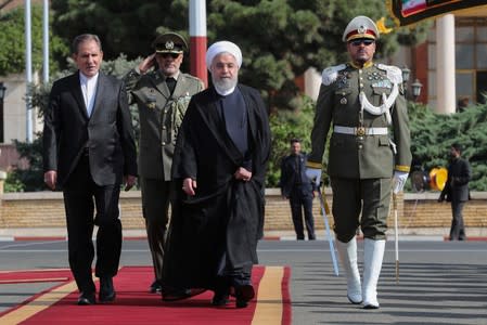 Iranian President Hassan Rouhani walks during a farewell ceremony before leaving for New York, in Tehran