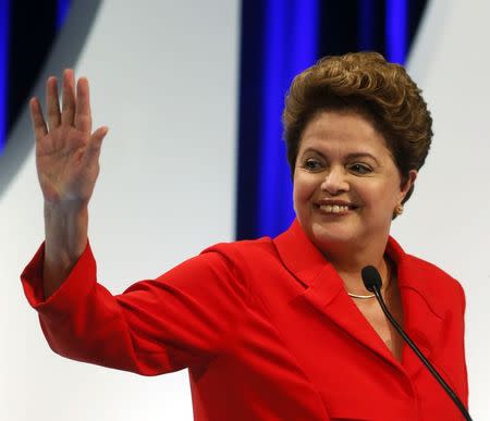 Presidential candidate Dilma Rousseff of Workers Party (PT) waves to the crowd before she takes part in a TV debate in Sao Paulo September 1, 2014. REUTERS/Paulo Whitaker