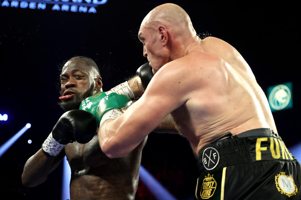 Tyson Fury (R) punches Deontay Wilder during their Heavyweight bout for Wilder's WBC and Fury's lineal heavyweight title on February 22, 2020 at MGM Grand Garden Arena in Las Vegas, Nevada. (Al Bello/Getty Images)