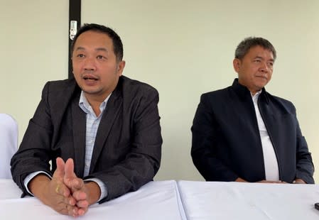 Sattra Toaon (left) and Songklod “Pukem” Chuenchoopol, founders of Right wing group, the Thai Wisdom Guard talk to Reuters in Nonth