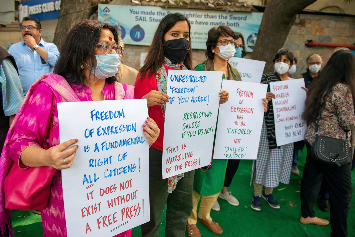 Journalists stage a silent sit-in to protest media gagging outside the Press Club of India in Delhi, on Feb. 18, 2021.