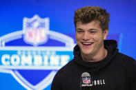 FILE - Michigan quarterback J.J. McCarthy speaks during a press conference at the NFL football scouting combine in Indianapolis, Friday, March 1, 2024. McCarthy is a possible first round pick in the NFL Draft.(AP Photo/Michael Conroy, File)