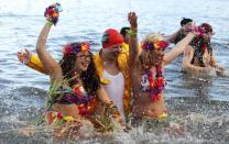 Swimmers in fancy dress participate in the New Year's Day Looney Dook swim at South Queensferry in Scotland January 1, 2013.