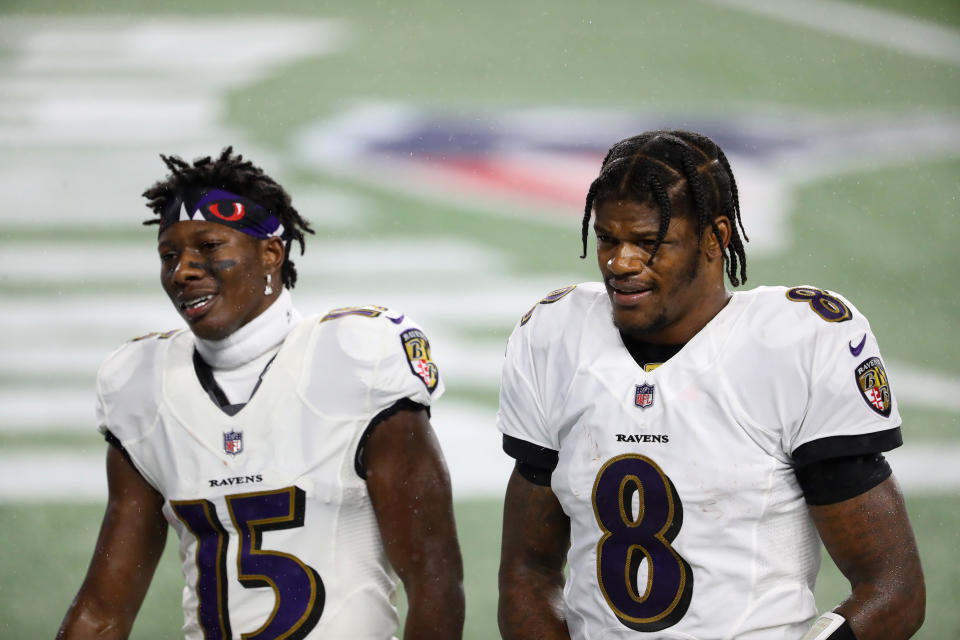 Lamar Jackson #8 and Marquise Brown #15 of the Baltimore Ravens 