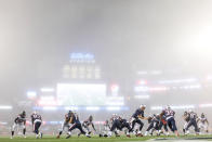 <p>Oct 22, 2017; Foxborough, MA, USA; New England Patriots quarterback Tom Brady (12) hands the ball off to running back Mike Gillislee (35) in the fog during the second half against the Atlanta Falcons at Gillette Stadium. Mandatory Credit: Greg M. Cooper-USA TODAY Sports TPX IMAGES OF THE DAY </p>