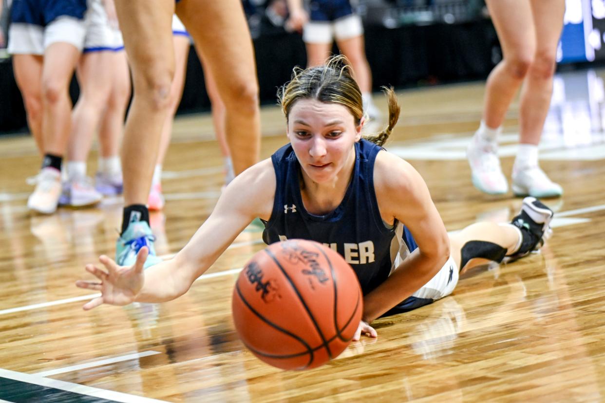 Fowler's Katie Spicer goes after the ball during the fourth quarter in the Division 4 girls basketball state semifinal against Ishpeming on Thursday, March 21, 2024, at the Breslin Center in East Lansing.