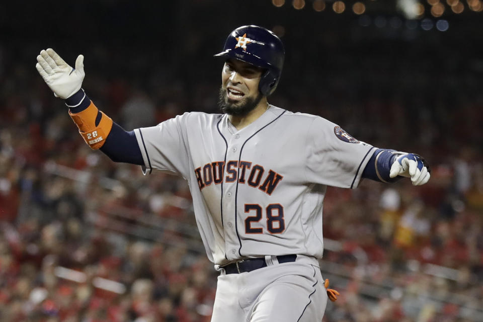 Houston Astros' Robinson Chirinos celebrates after his home run against the Washington Nationals during the sixth inning of Game 3 of the baseball World Series Friday, Oct. 25, 2019, in Washington. (AP Photo/Jeff Roberson)
