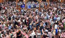 <p>Throngs of people drink together in one of the Oktoberfest tents. (Getty Images/Joerg Koch) </p>