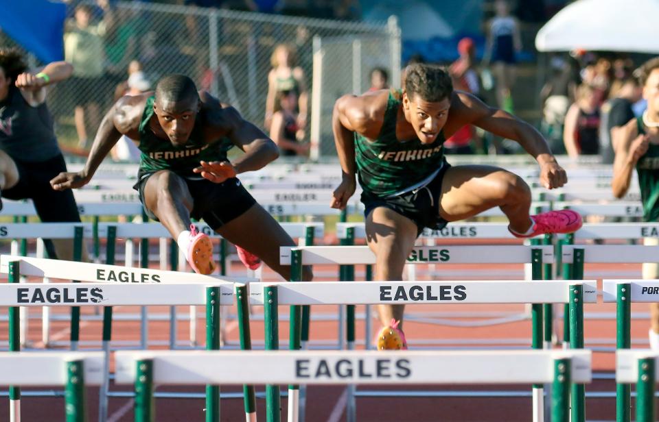 George Jenkins' Rey Hernandez, right, edges teammate Joshua Valentin for the win in the 100 hurdles on Thursday at the Lakeland City Meet.