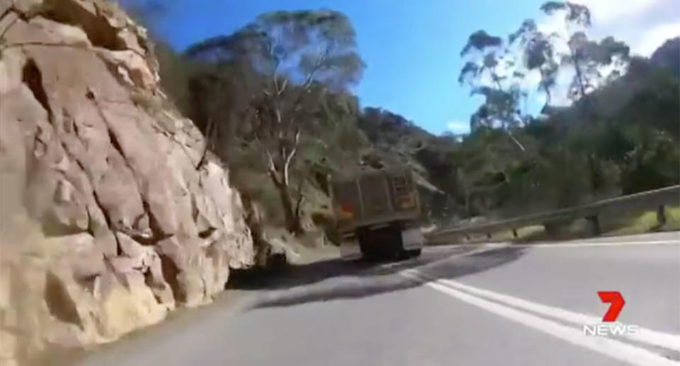 The truckie veers onto the wrong side of the road on a sharp bend on the Adelaide Hills. Source: 7 News