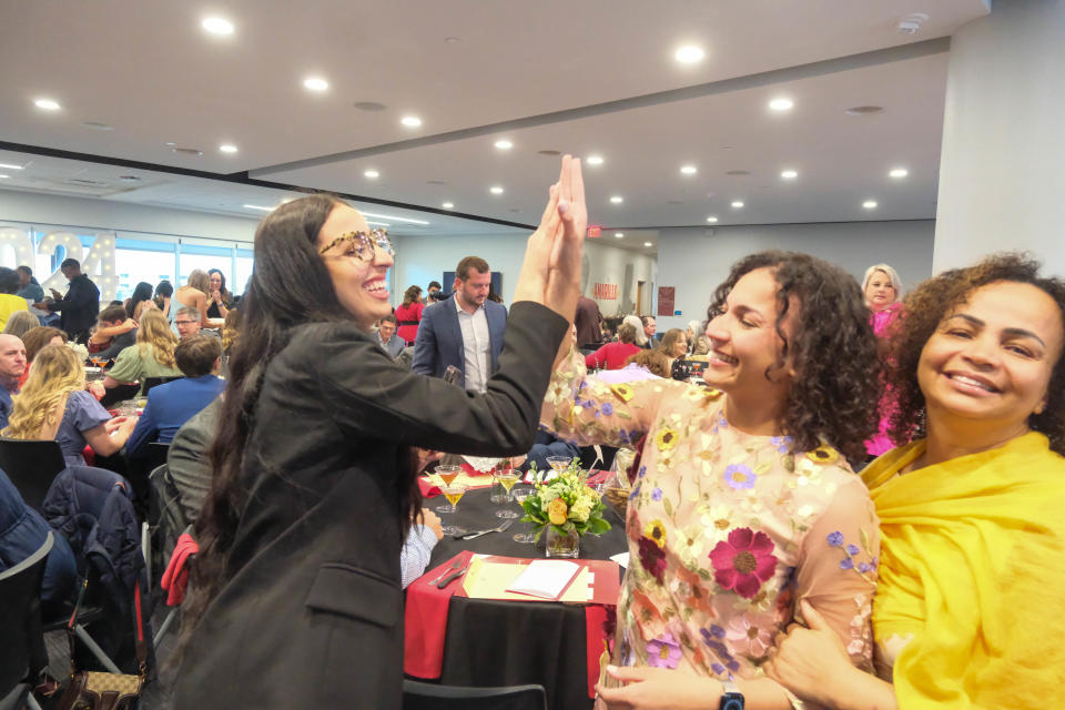 Texas Tech University Health Sciences Center School of Medicine graduates give high fives after receiving their next assignment at Match Day Friday at Hodgetown.