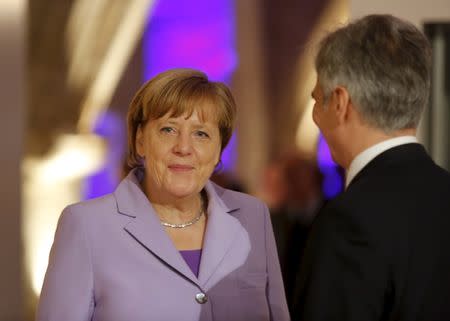 German Chancellor Angela Merkel speaks with Austrian Chancellor Werner Faymann during the Valletta Summit on Migration in Valletta, Malta, November 12, 2015. REUTERS/Darrin Zammit Lupi