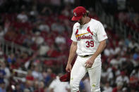 St. Louis Cardinals starting pitcher Miles Mikolas walks off the field after being removed during the fifth inning of a baseball game against the New York Mets Tuesday, May 7, 2024, in St. Louis. (AP Photo/Jeff Roberson)