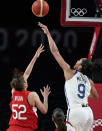 United States' A'Ja Wilson (9), right, blocks a shot by Japan's Yuki Miyazawa (52) during women's basketball preliminary round game at the 2020 Summer Olympics, Friday, July 30, 2021, in Saitama, Japan. (AP Photo/Charlie Neibergall)