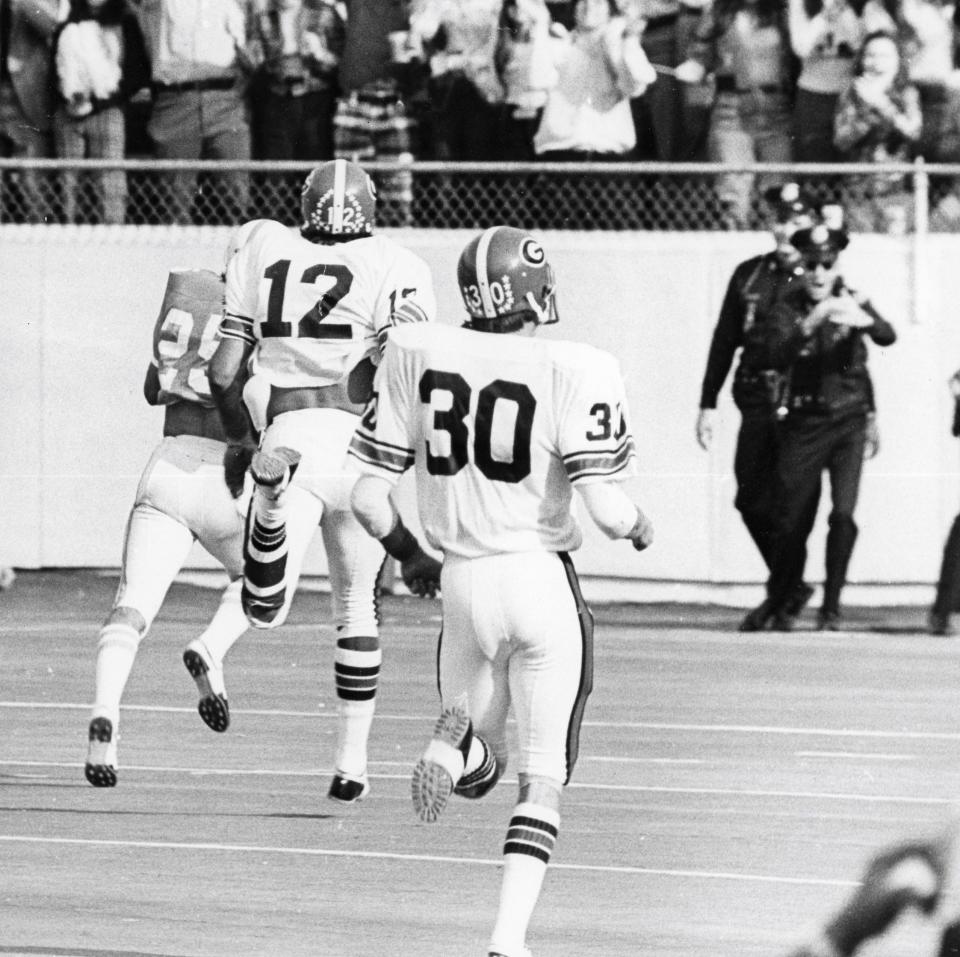 The University of Tennessee football player Eddie Brown scoring a touchdown against Georgia on a punt return in 1973.