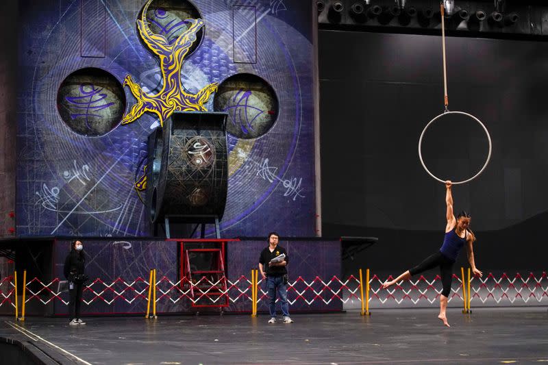 A performer trains for the Cirque du Soleil "The Land of Fantasy" show in Hangzhou