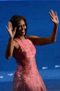 First lady Michelle Obama waves as she takes the stage during day one of the Democratic National Convention at Time Warner Cable Arena on September 4, 2012 in Charlotte, North Carolina. The DNC that will run through September 7, will nominate U.S. President Barack Obama as the Democratic presidential candidate. (Photo by Kevork Djansezian/Getty Images)