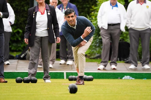 Rishi Sunak plays a game of bowls during a visit to Market Bosworth Bowling Club
