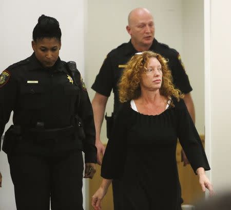 Tonya Couch (R) is escorted by deputies into Criminal District Court in Fort Worth, Texas, January 11, 2016. REUTERS/David Kent/Ft. Worth Star-Telegram/Pool