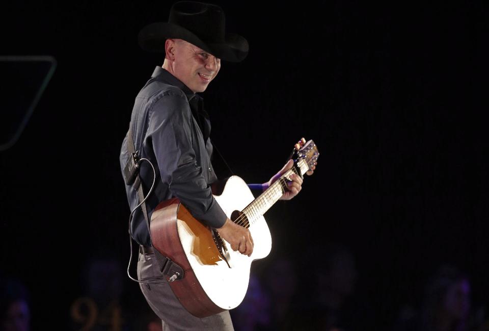 Kenny Chesney performs during a tribute to songwriter Dean Dillon at the BMI Country Awards on Tuesday, Nov. 5, 2013, in Nashville, Tenn. (AP Photo/Mark Humphrey)